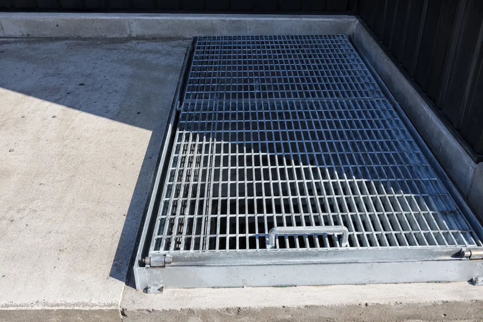 Latched and Hinged Grates in Bradford, Ontario, fabricated and installed by The Grate Guys