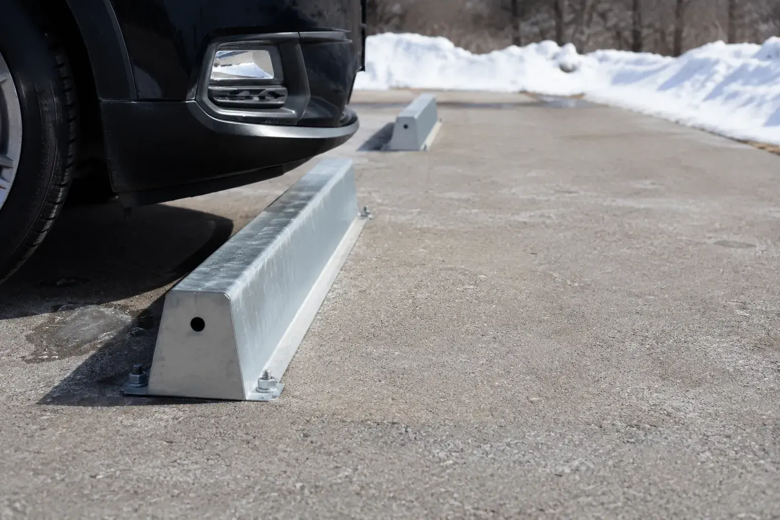 Wheel Stops in Markham, Ontario, fabricated and installed by The Grate Guys